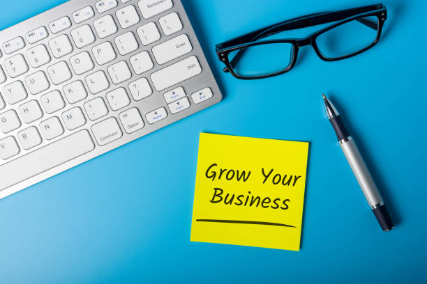 Grow Your Business message on office workplace.