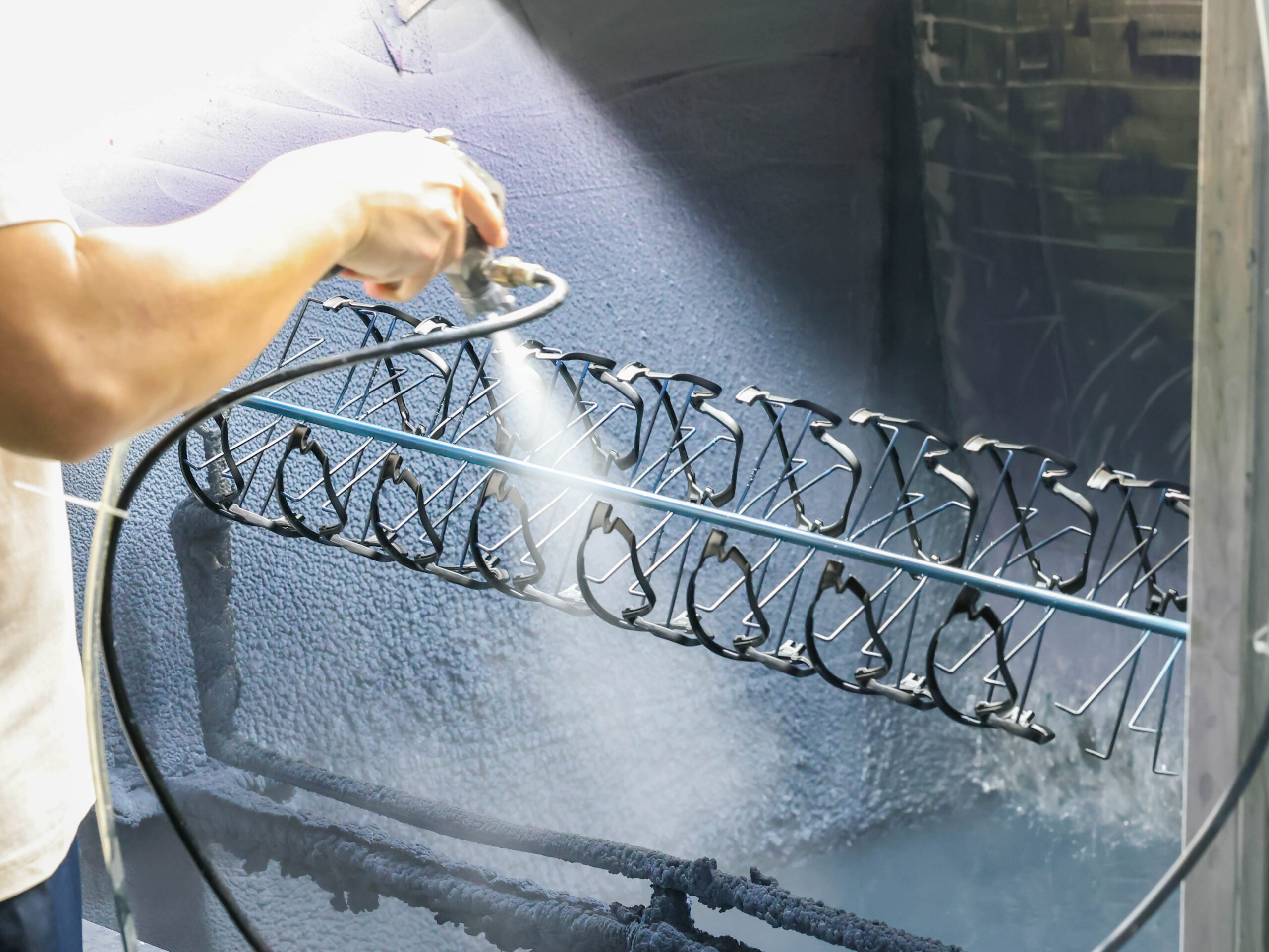 Spray painting and coating of sunglasses frames